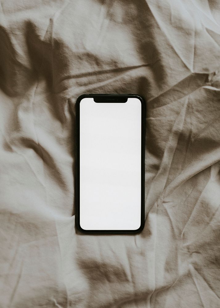 Blank screen smartphone on  fabric textured background