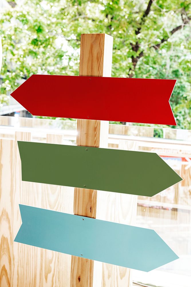Wooden arrow sign mockup psd directions in the park