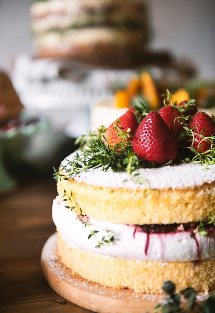 Layered cake with fresh cream and strawberries