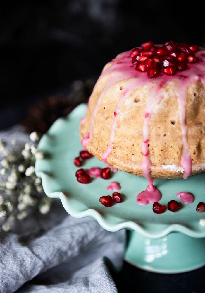 Dome shaped cake topped with pomegranate