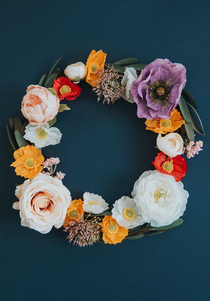 Pastel wreath on blue background