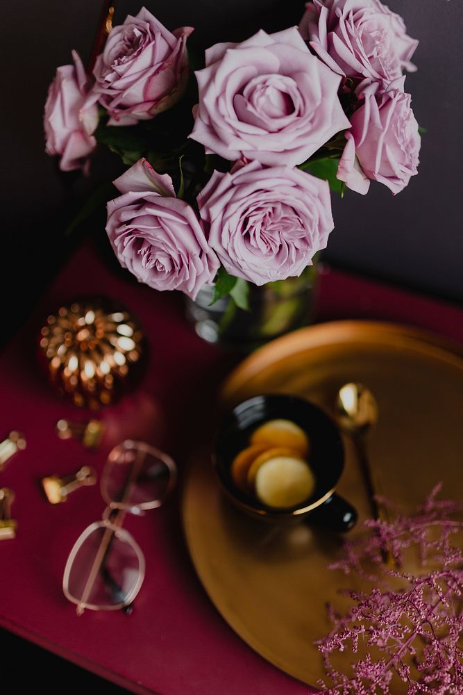 Lemon tea on a brass tray by the flower vase