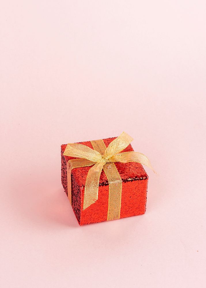 Red gift box with golden ribbon