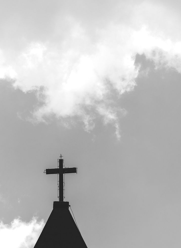 A cross on top of a church tower