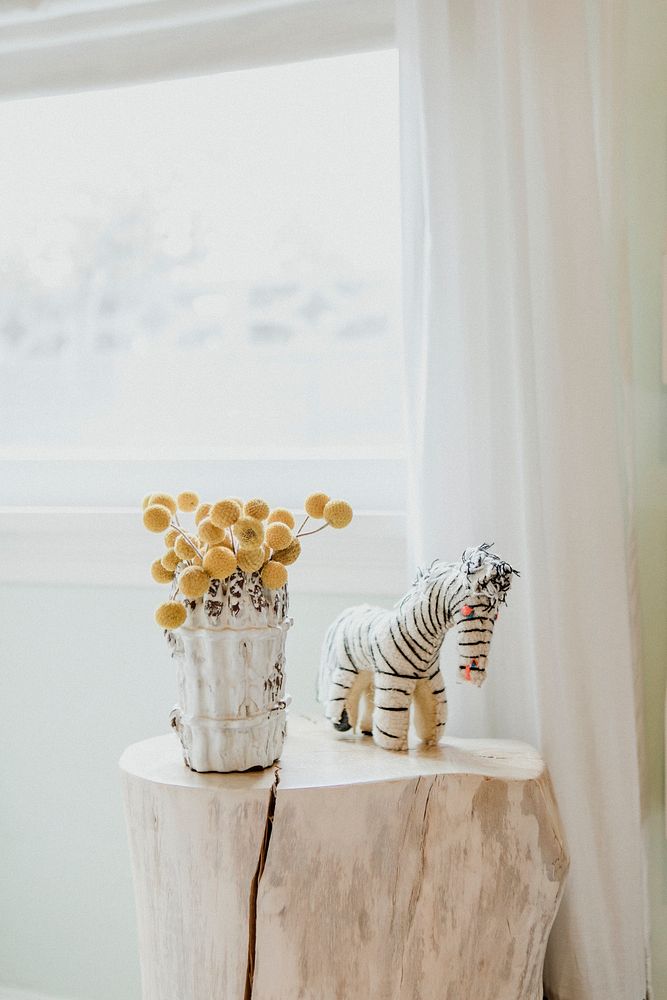 Flowers and zebra doll decorate on marble stand