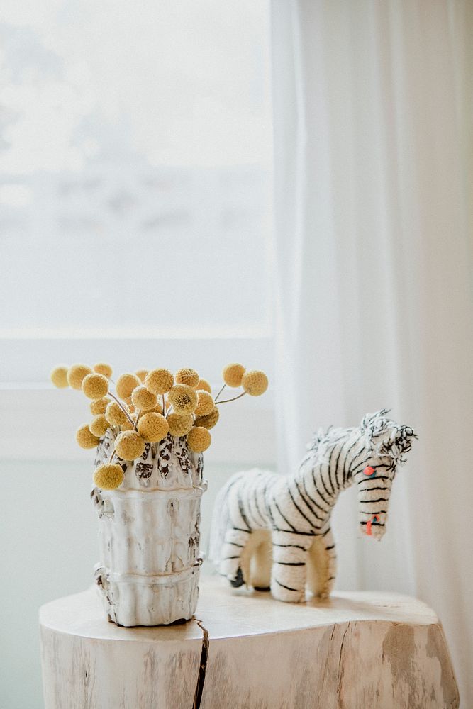 Flowers and zebra doll decorate on marble stand