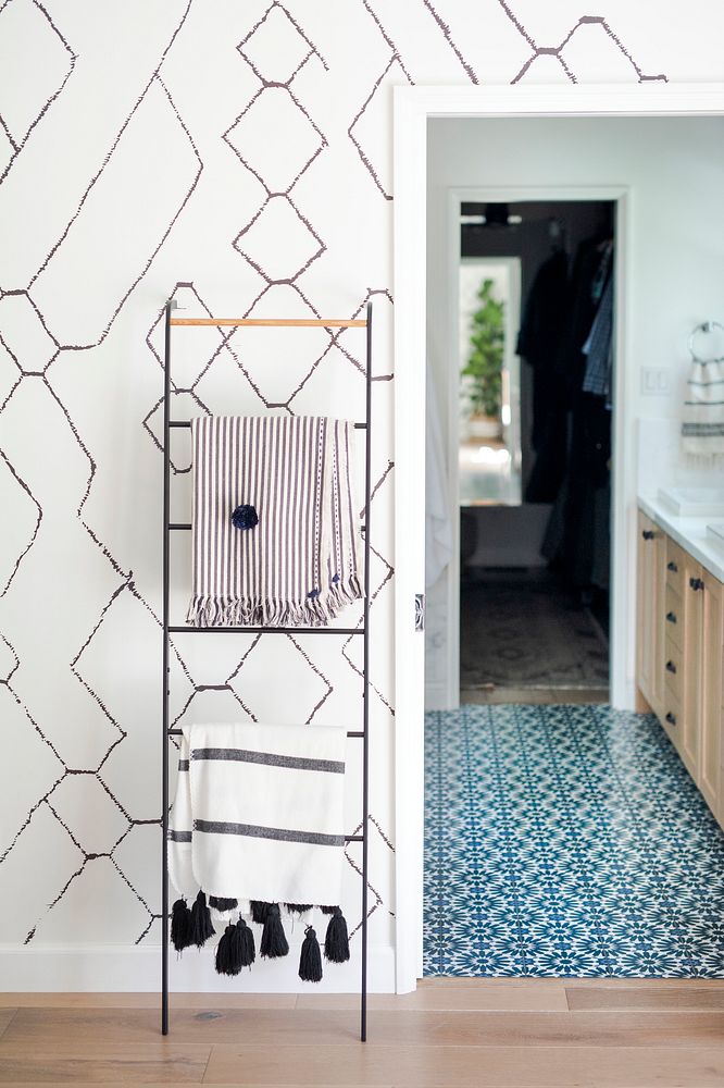 Ladder for hanging clothes by the bathroom entrance