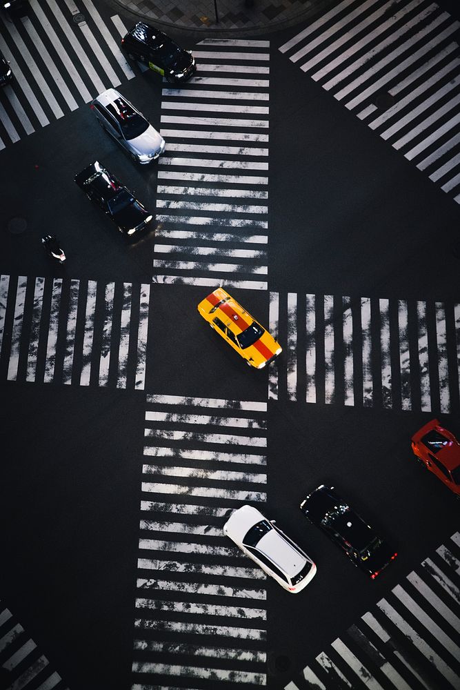 Cars on a crosswalk in Japan