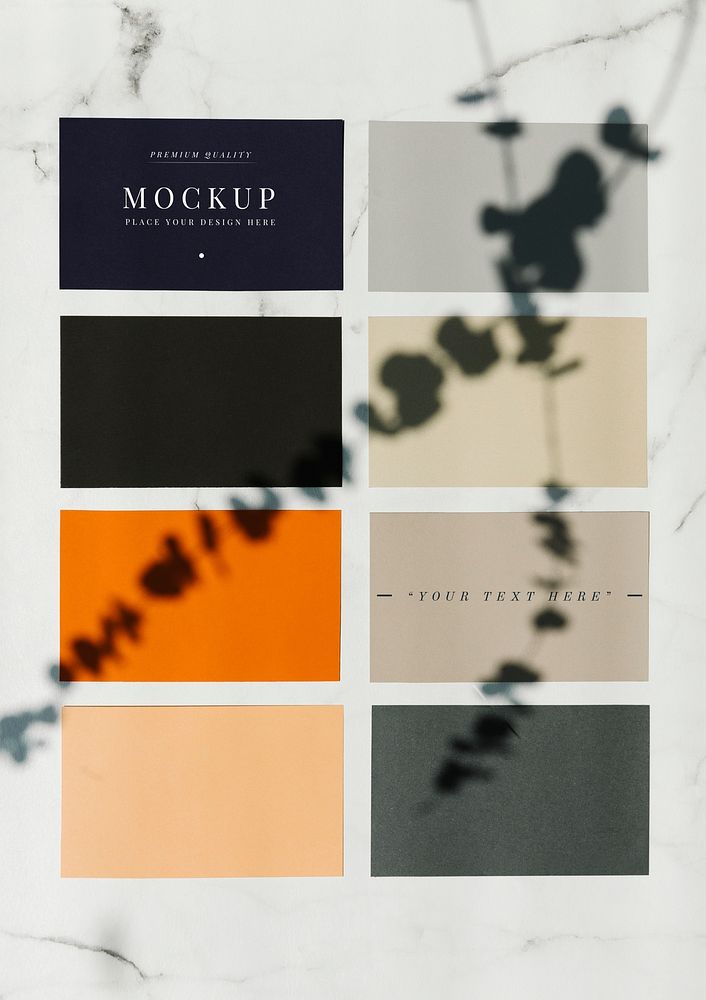Colored sample paper square mockups on a marble table