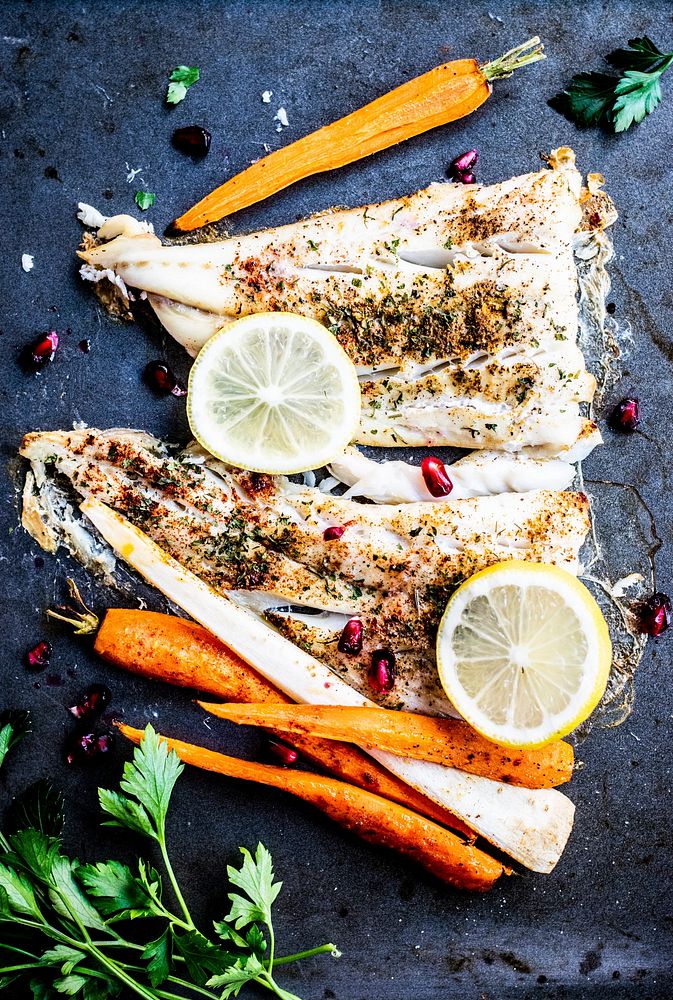 White fish with roasted vegetables and pomegranate food photography recipe idea
