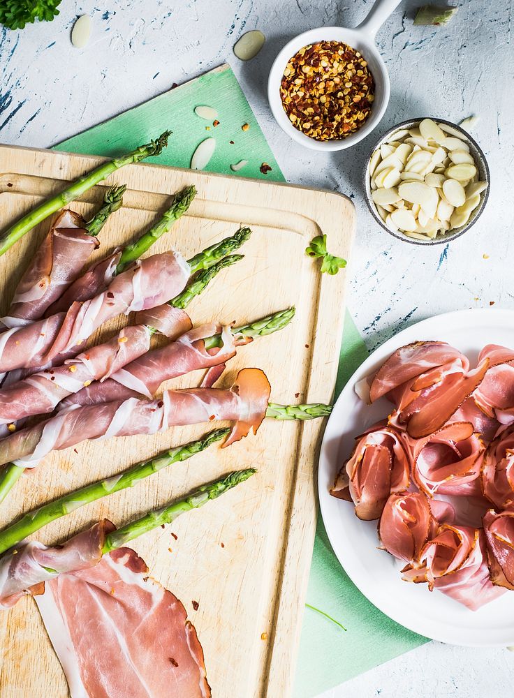 Asparagus wrapped in Parma ham Premium Photo rawpixel