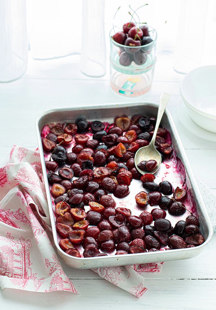 Freshly baked cherries on a baking tray