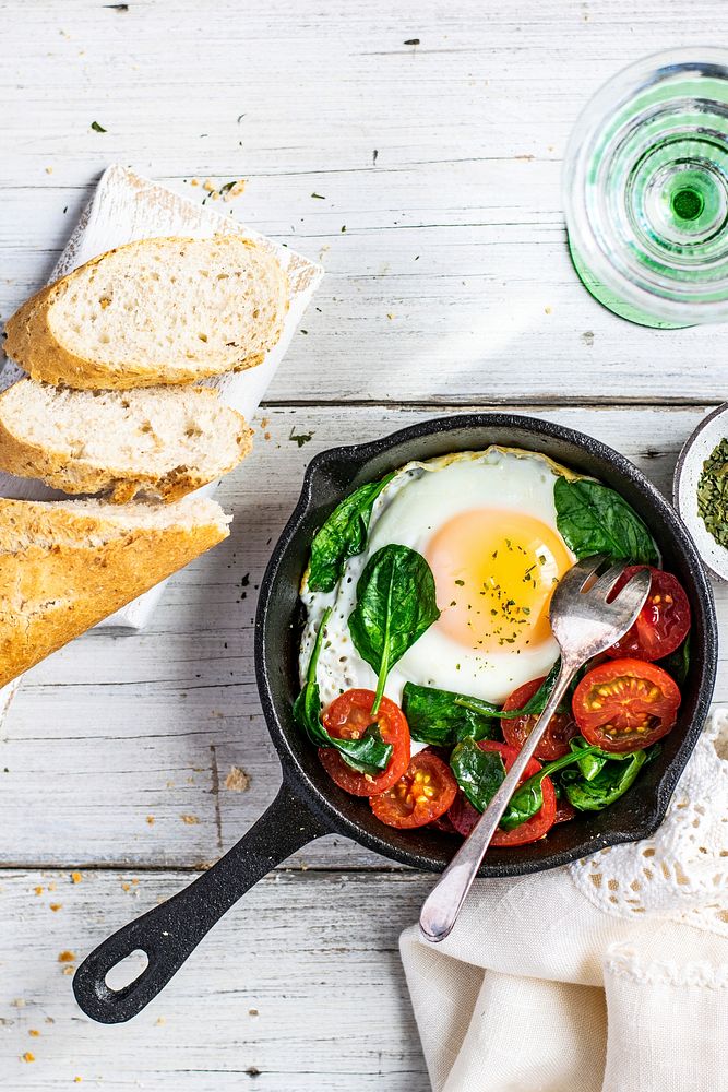 Freshly cooked egg and tomatoes in a pan