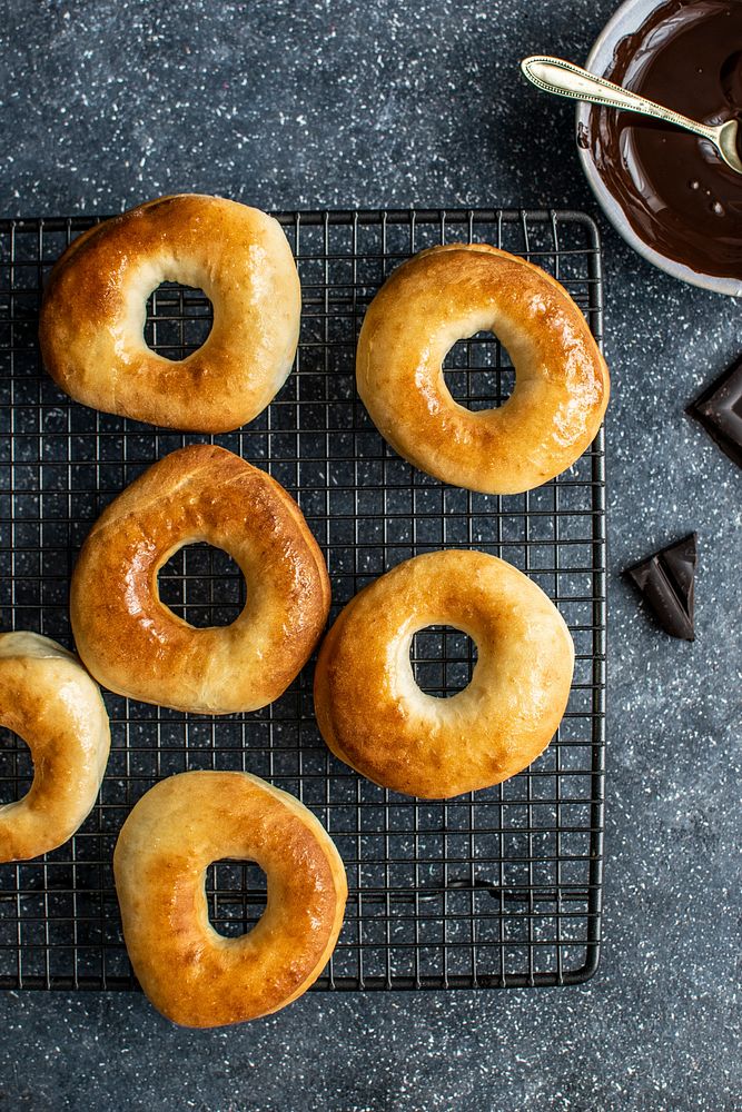 Freshly baked homemade donuts on a cooling rack