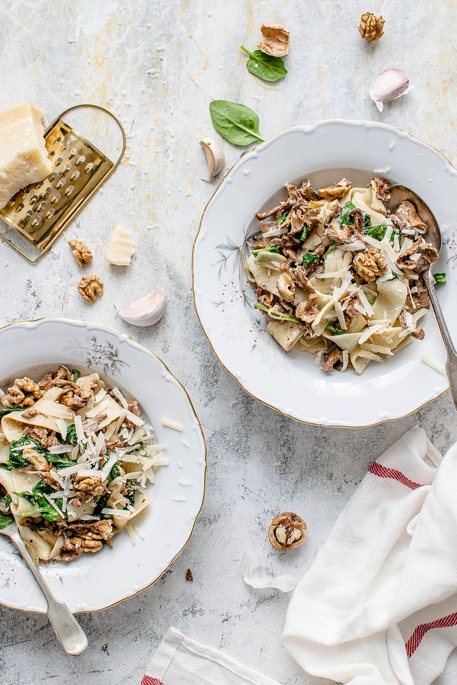 Serving of homemade pappardelle pasta with mushrooms and parmesan cheese