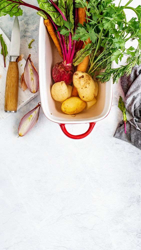 Fresh organic vegetables in a white bowl aerial view