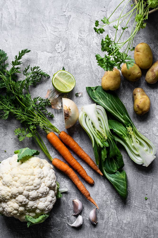 Various fresh organic vegetables on a gray kitchen top