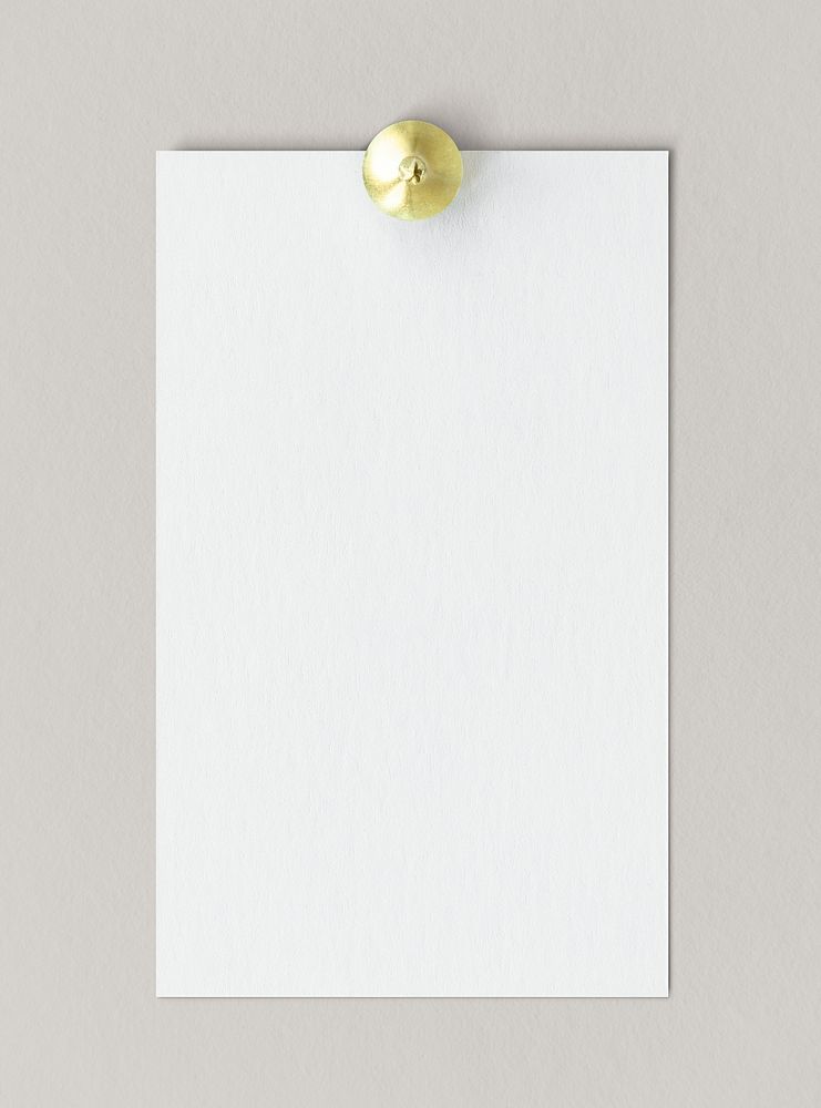 Blank white paper pinned to the wall