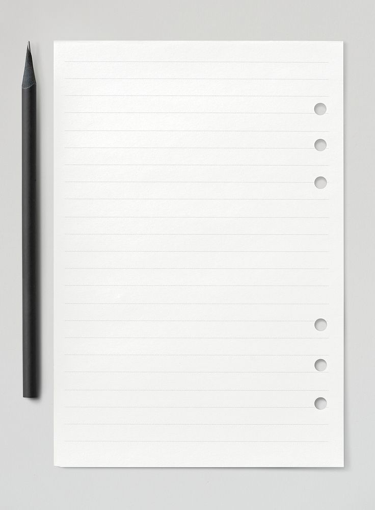 Blank white lined paper with black pencil