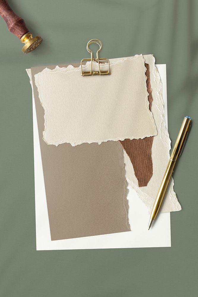 Blank torn brown paper templates set with a paperclip