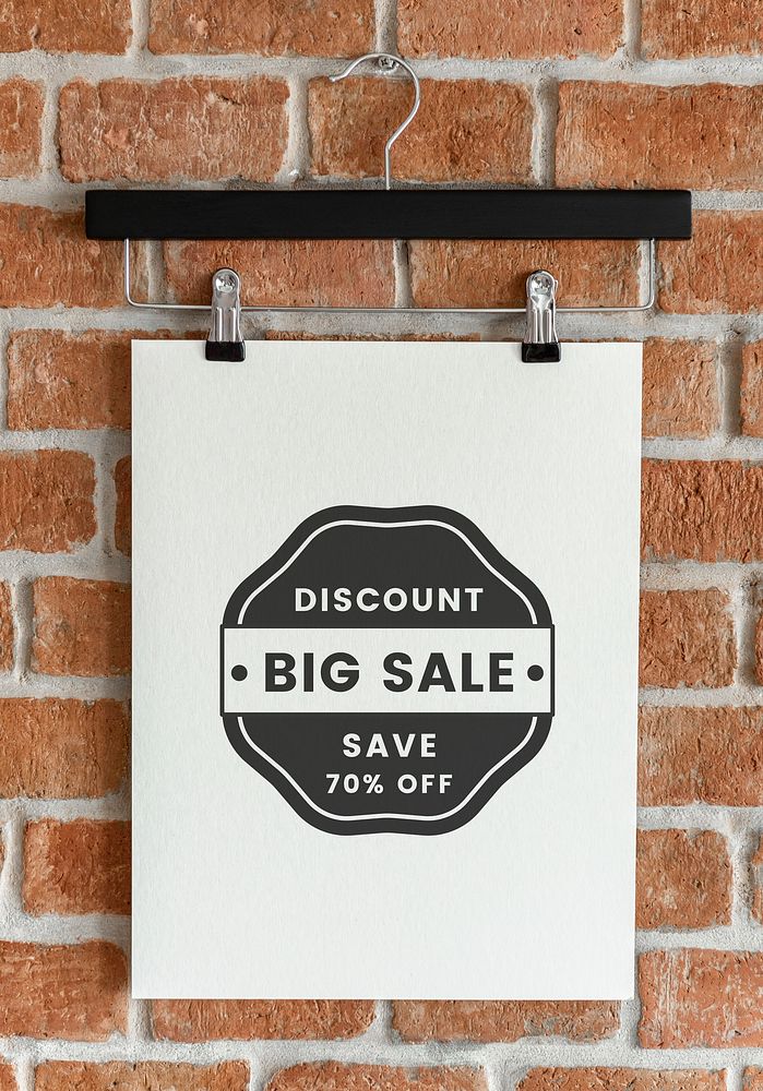 Design hanging from a clothes hanger poster mockup