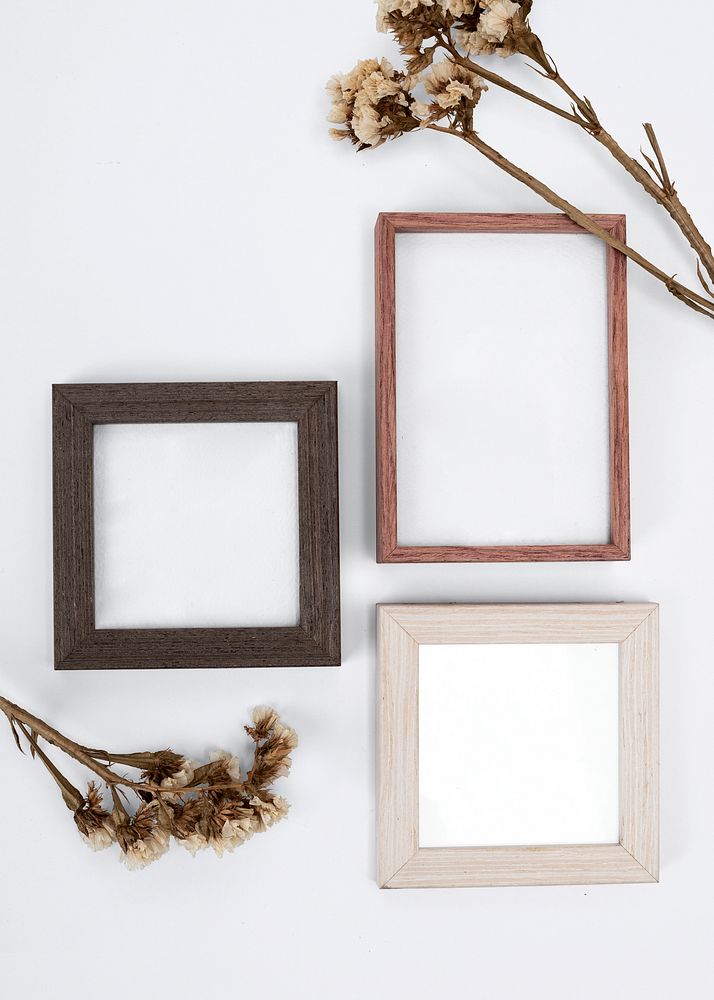 Wooden picture frames mockup psd on the wall home decor
