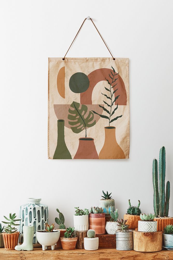 Poster psd hanging over a shelf full of cacti and succulents 