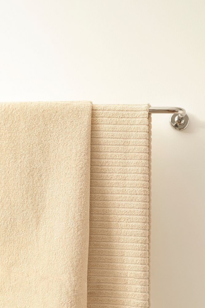 Bath towel mockup psd, hanging on a rack, home decor