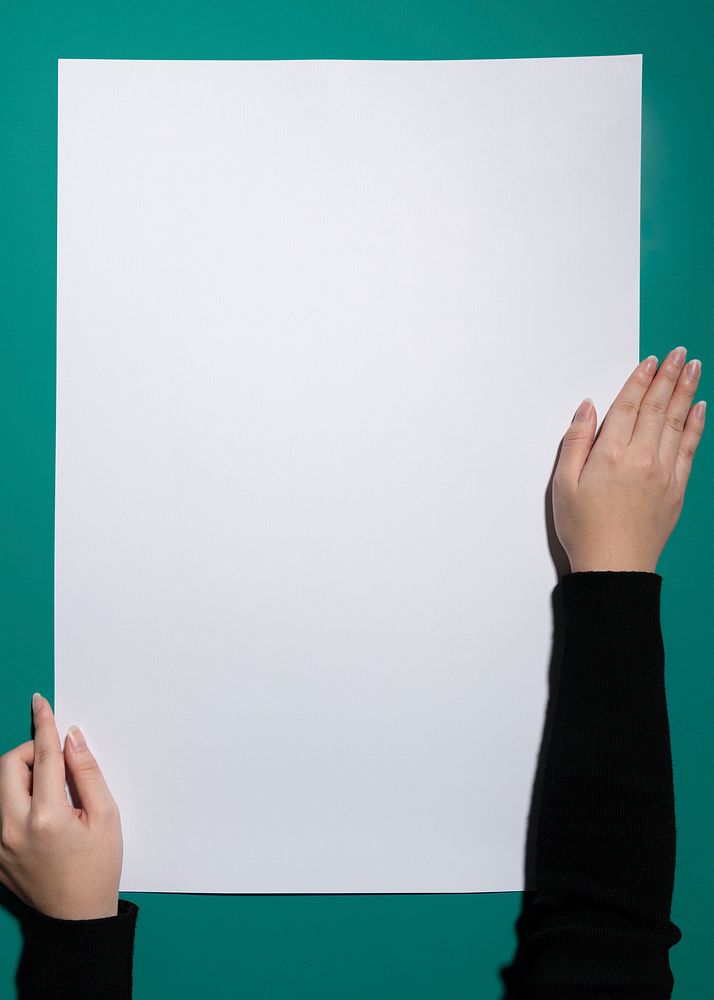 Blank white paper, green background, design space