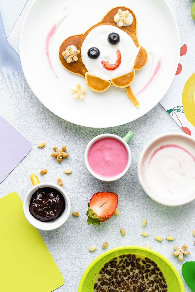 Cute breakfast, kids pancakes and chocolate cereal