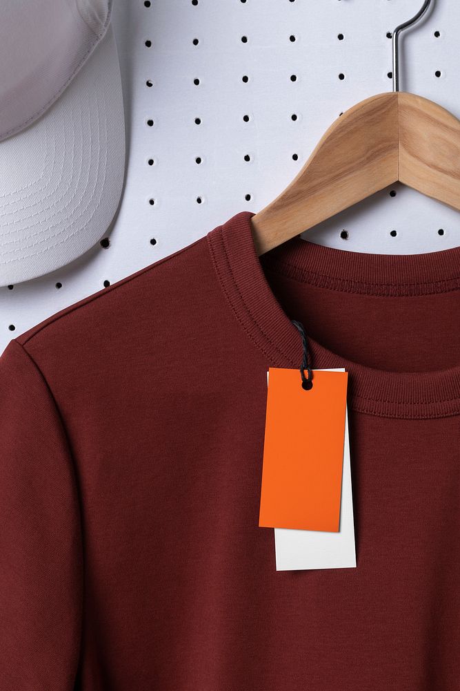 Orange clothing tag, simple apparel with blank design space