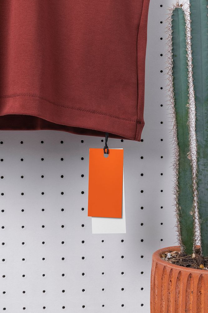 Orange clothing tag, simple apparel with blank design space