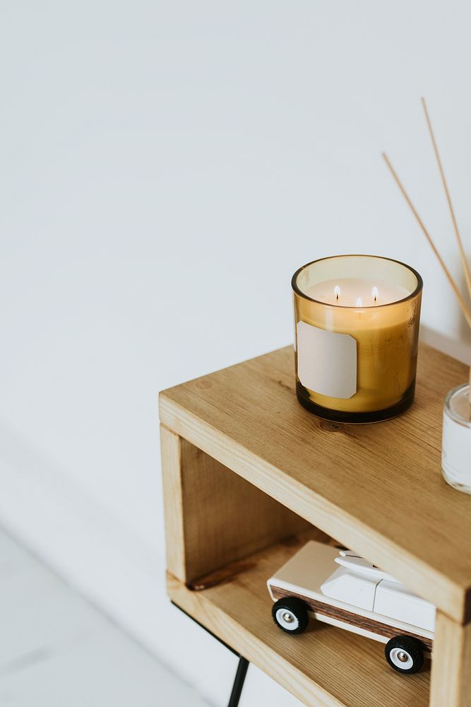 Scented candle on shelf, aesthetic home decor 