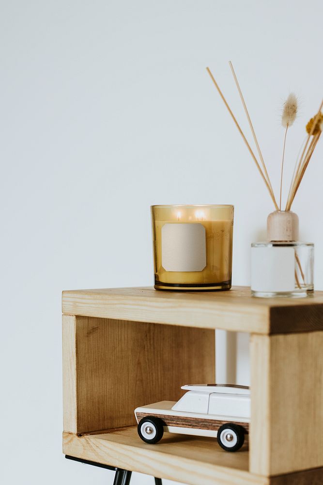 Scented candle on shelf, aesthetic home decor 