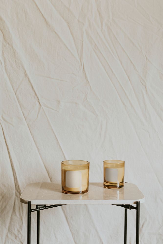 Aesthetic spa background, aroma candles on table 