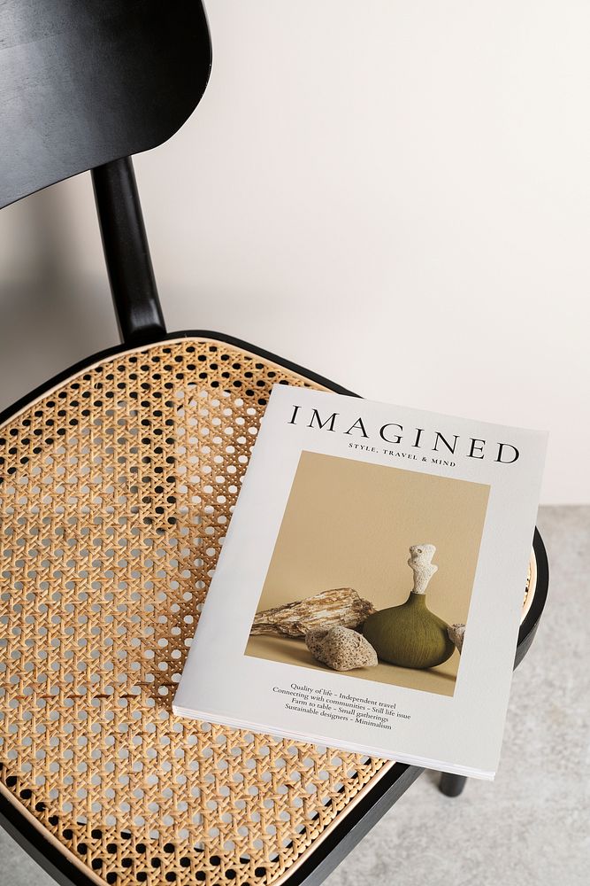Magazine mockup psd, book on rattan chair
