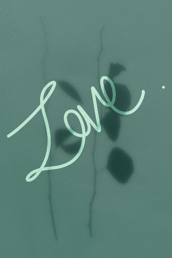 Love word on a green background with leaves shadow