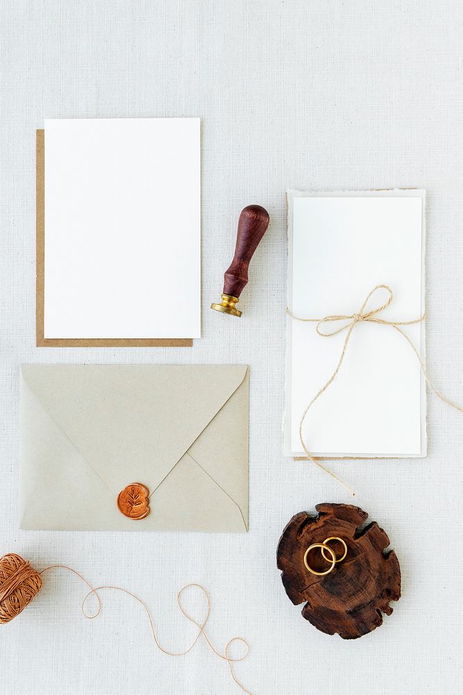 White paper notes and envelope on fabric textured background