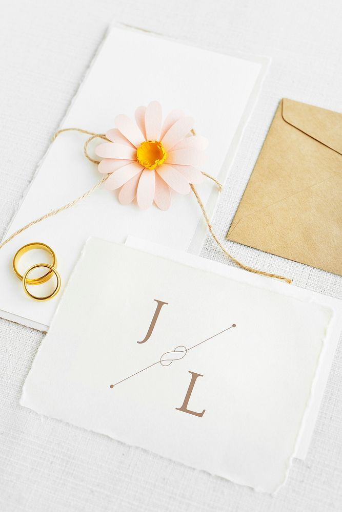 White wedding card template mockup with golden rings