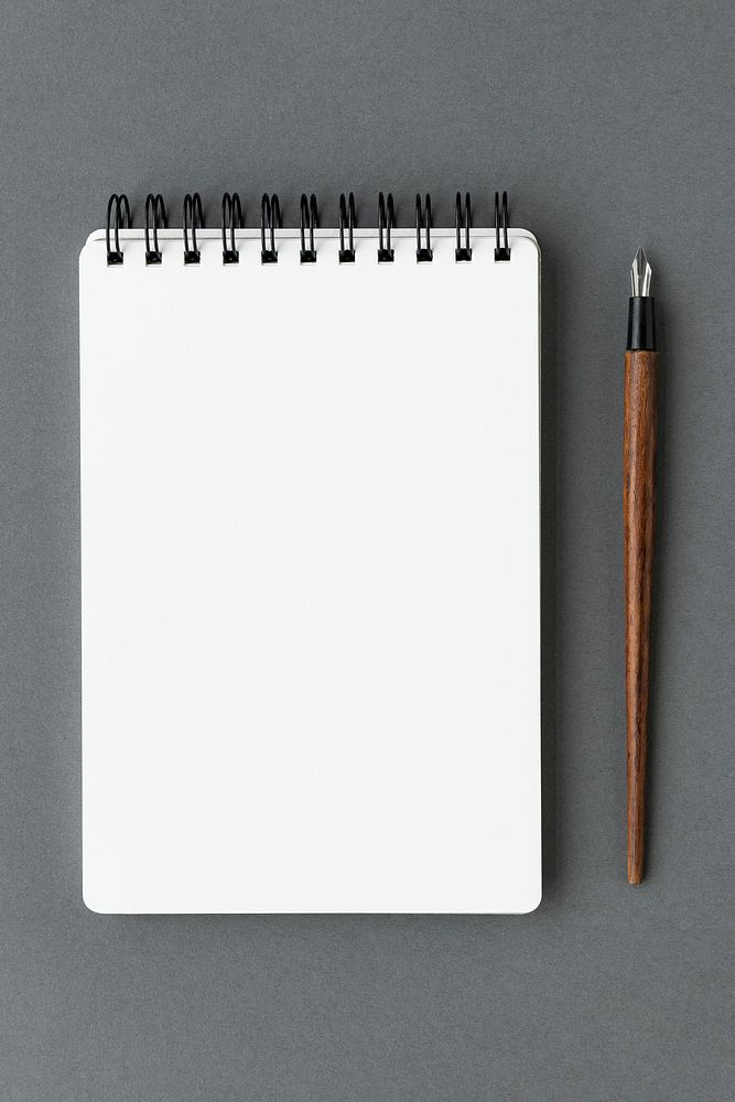 Blank plain white notebook with a fountain pen