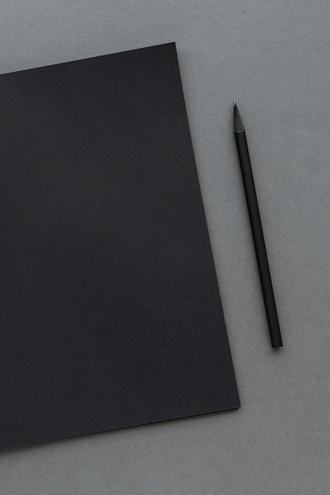 Black notebook with a wooden pencil