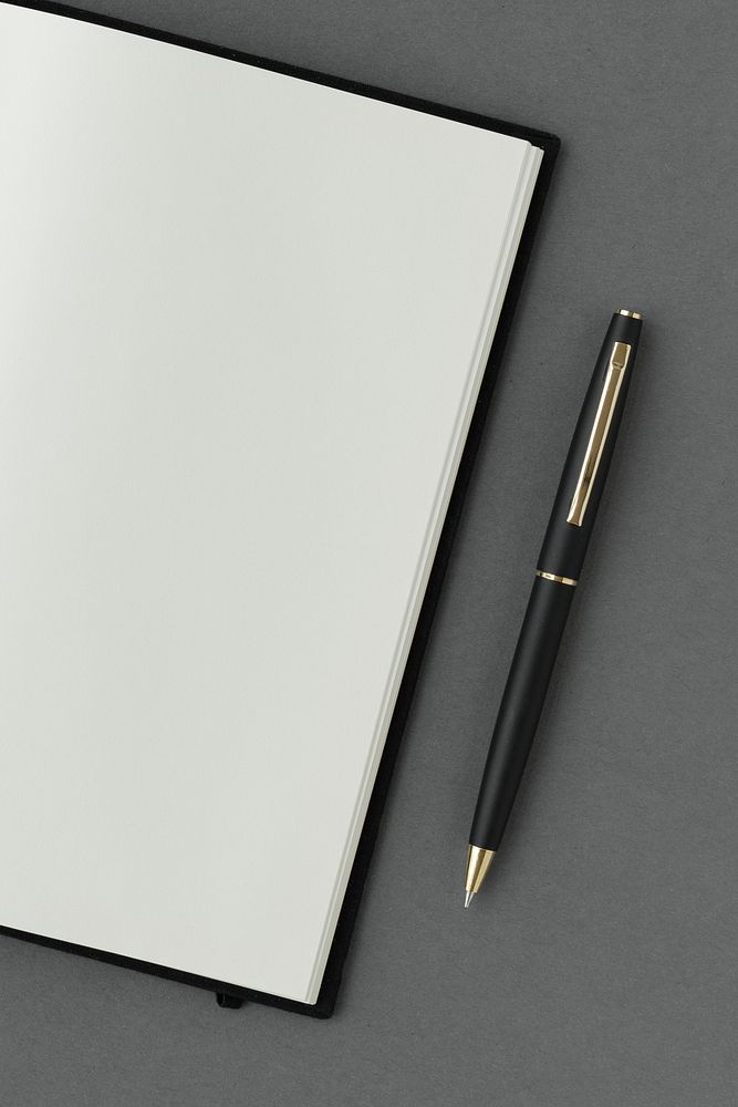 Blank plain white notebook with a black pen