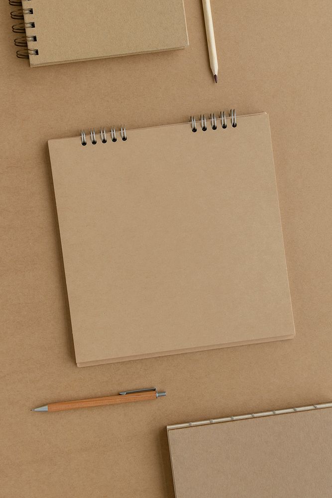 Natural brown paper notebook with pencils