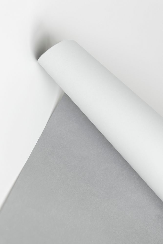 Gray and white rolled paper on a gray background
