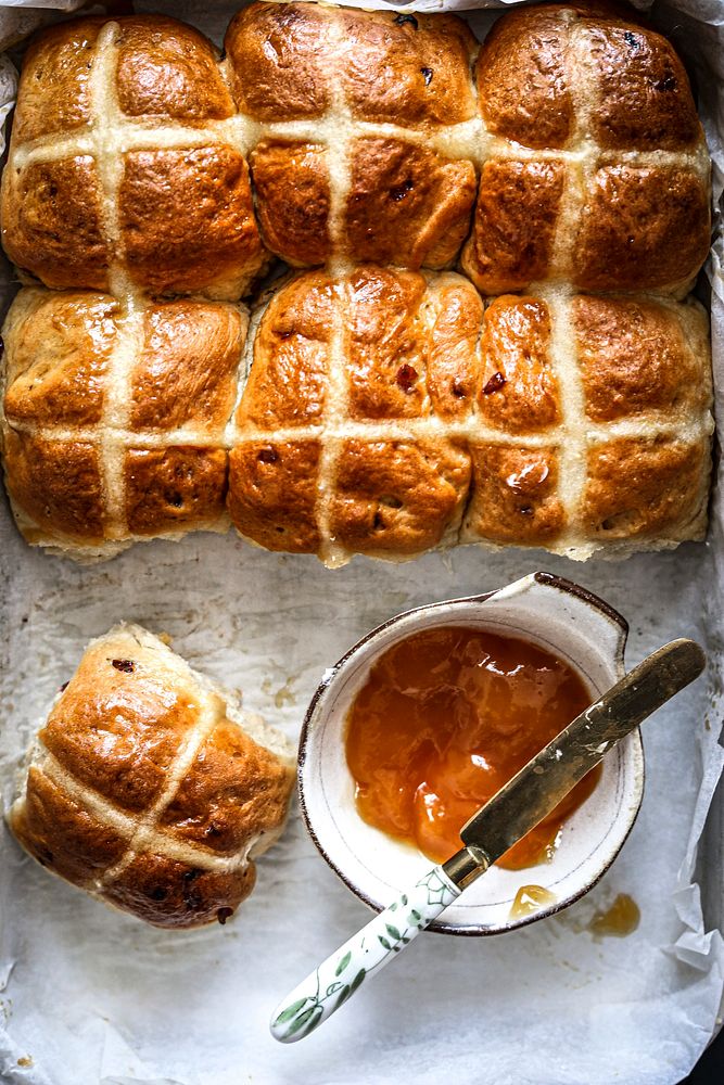 Freshly baked hot cross buns with apricot jam 