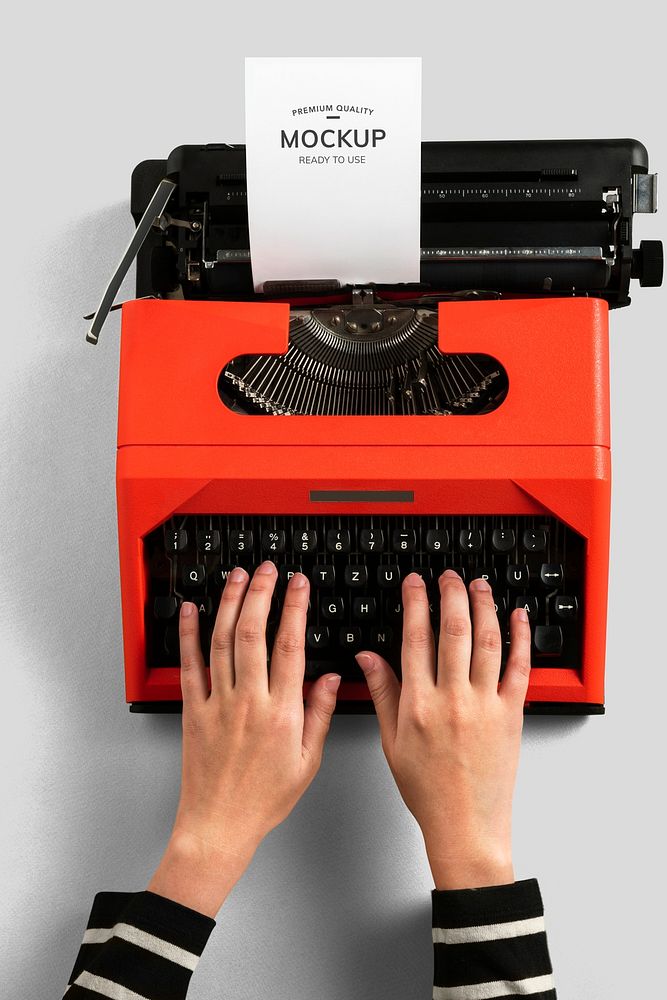 Typing on a red retro typewriter mockup