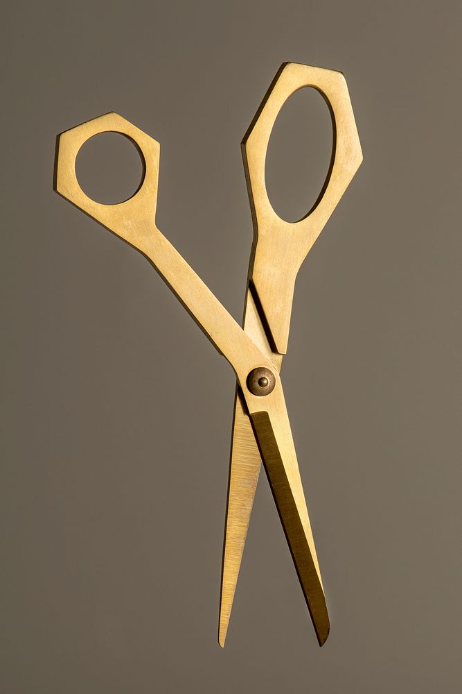 Premium shiny golden scissors design resource