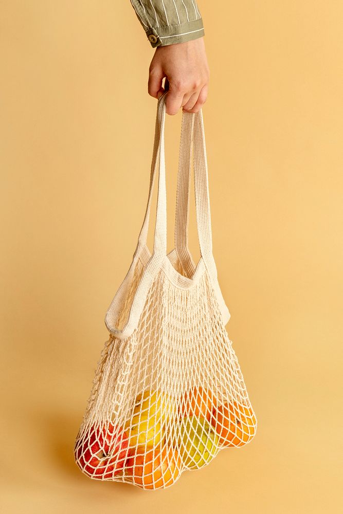 Hand holding a reusable net bag