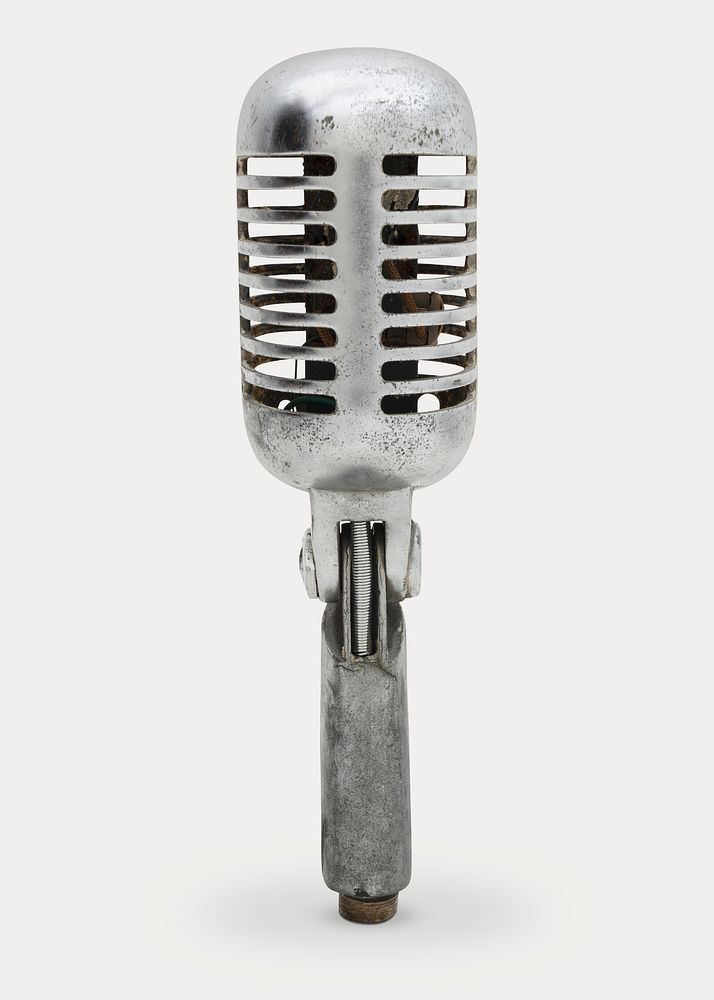 Vintage silver microphone on off white background