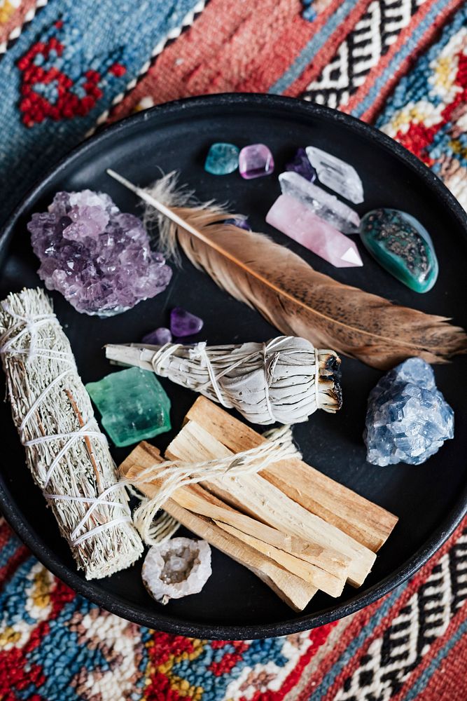 Woman with sage and crystals ready for smudging